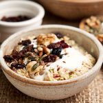 Bircher Muesli Recipe - Close up of bowl showing oats, yogurt and toppings | The Worktop