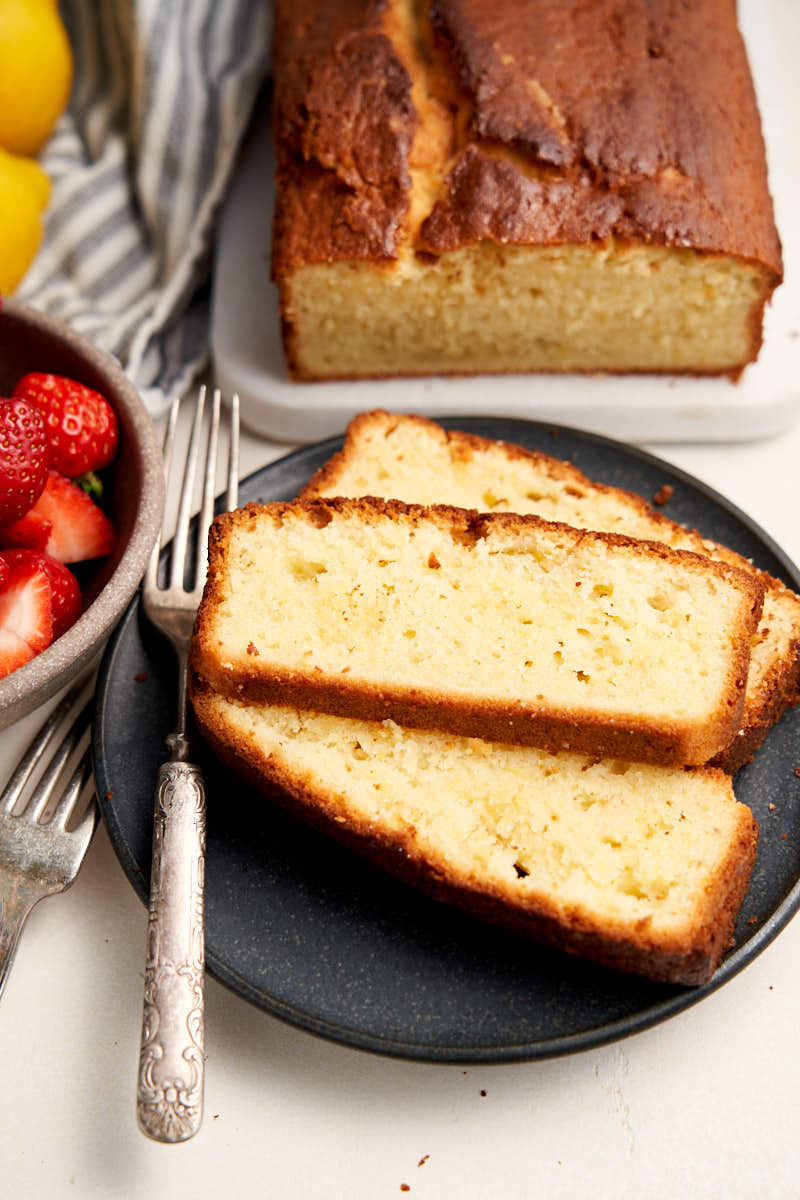 Best Lemon Pound Cake - with sour cream, sliced on a plate to serve | The Worktop