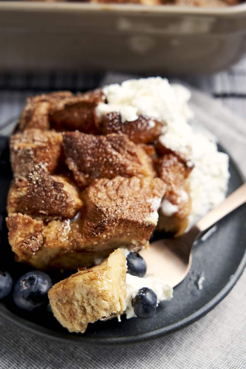 Overnight Challah French Toast - sliced with blueberries and whipped cream for brunch | The Worktop