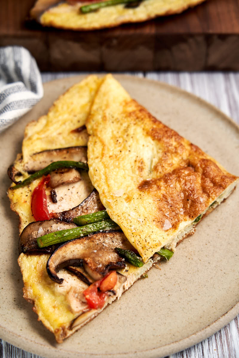 Chicken Omelette - plated for breakfast, showing asparagus, mushrooms and tomatoes | The Worktop