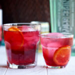 Cranberry Gin Mocktail - 2 glasses with orange garnish