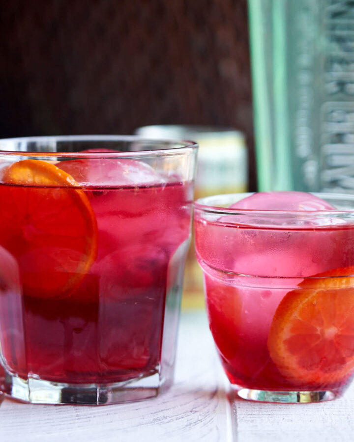 Cranberry Gin Mocktail - 2 glasses with orange garnish