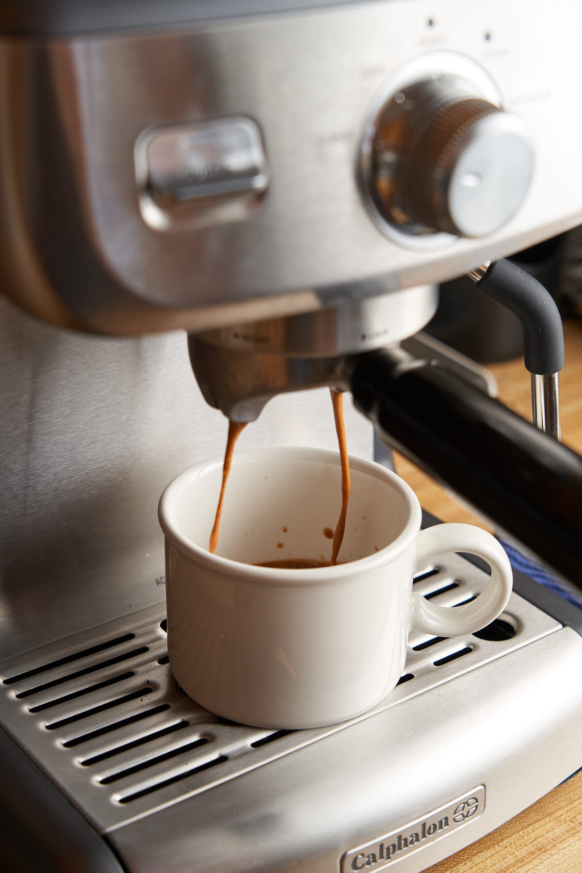 Making espresso shot with home espresso machine