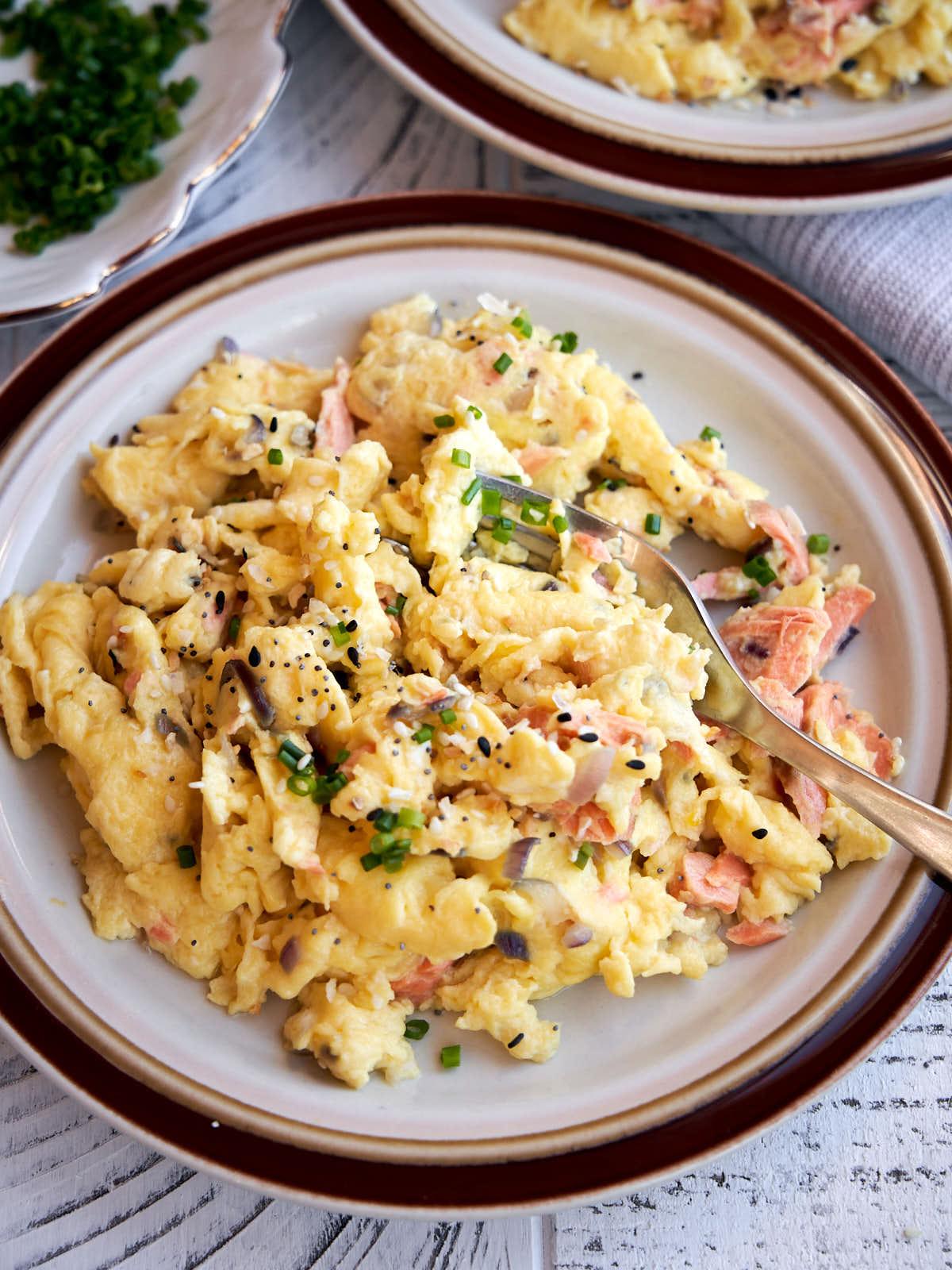 salmon breakfast idea with scrambled eggs with a fork